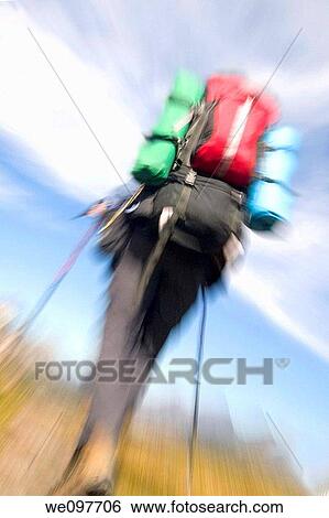 woman backpacker hiking on trail in mountains View Large Photo Image Stock Photograph - woman backpacker hiking on trail in mountains. Fotosearch