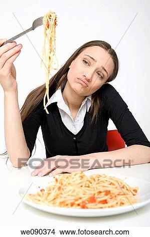 Picture - Woman Eating Spaghetti. Fotosearch