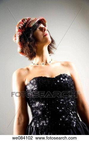 Woman wearing a hat and an evening gown. View Large Photo Image Stock Image - Woman wearing a hat and an evening gown.. Fotosearch