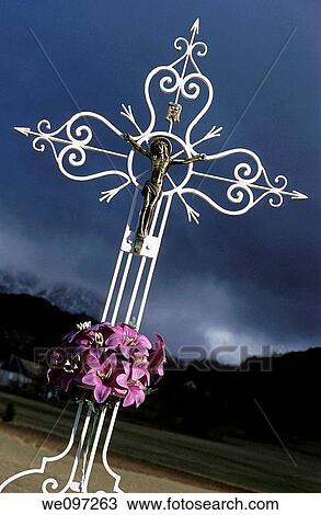 Stock Image - Wrought iron cross with jesus christ. Fotosearch