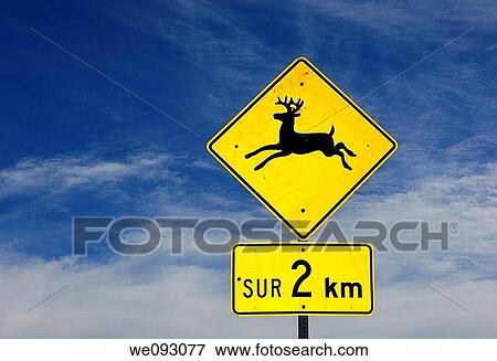 Stock Photo - Yellow and black warning sign for mooses, distance indication in French, Province of Quebec, Canada. Fotosearch