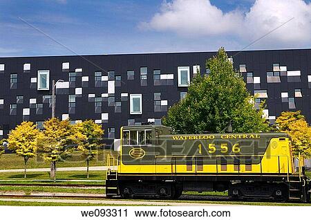 Yellow green historic Waterloo Central Railway train car with modern Perimeter Institute building View Large Photo Image Stock Image - Yellow green historic Waterloo Central Railway train car with modern Perimeter Institute building. Fotosearch