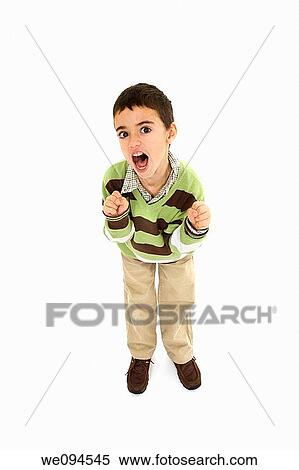 Young angry caucasian boy dressed in a casual outfit and standing on a white background View Large Photo Image Stock Photography - Young angry caucasian boy dressed in a casual outfit and standing on a white background. Fotosearch