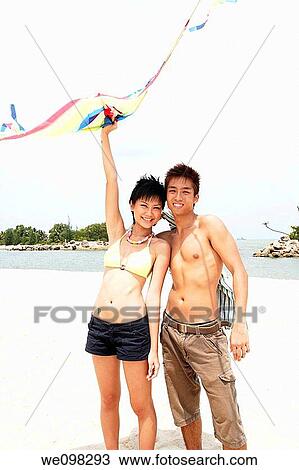 Young asian couple with kite View Large Photo Image Stock Image - Young asian couple with kite. Fotosearch