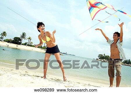 Young asian couple with kite View Large Photo Image Stock Photo - Young asian couple with kite. Fotosearch