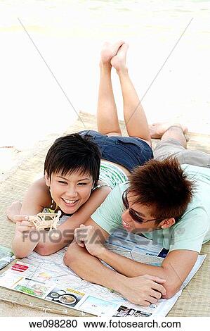 Young asian couple with toy airplane View Large Photo Image Stock Image - Young asian couple with toy airplane. Fotosearch