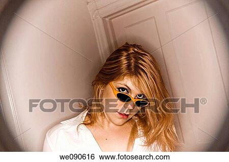 Young blond woman wearing sunglasses View Large Photo Image Stock Photograph - Young blond woman wearing sunglasses. Fotosearch