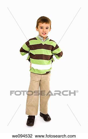 Young caucasian boy dressed in a casual outfit and standing on a white background View Large Photo Image Stock Image - Young caucasian boy dressed in a casual outfit and standing on a white background. Fotosearch