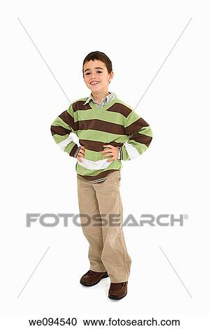 Young caucasian boy dressed in a casual outfit and standing on a white background View Large Photo Image Stock Image - Young caucasian boy dressed in a casual outfit and standing on a white background. Fotosearch