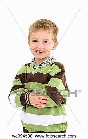 Young caucasian boy dressed in a casual outfit and standing on a white background View Large Photo Image Stock Photo - Young caucasian boy dressed in a casual outfit and standing on a white background. Fotosearch