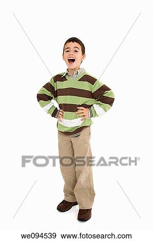 Young caucasian boy dressed in a casual outfit and standing on a white background View Large Photo Image Stock Photo - Young caucasian boy dressed in a casual outfit and standing on a white background. Fotosearch