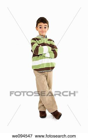 Young caucasian boy dressed in a casual outfit and standing on a white background View Large Photo Image Stock Photo - Young caucasian boy dressed in a casual outfit and standing on a white background. Fotosearch