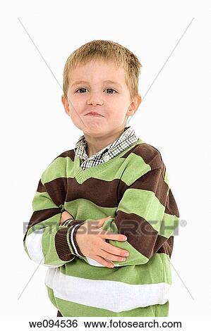 Young caucasian boy dressed in a casual outfit and displaying some attitude while standing on a white background View Large Photo Image Stock Photograph - Young caucasian boy dressed in a casual outfit and displaying some attitude while standing on a white background. Fotosearch