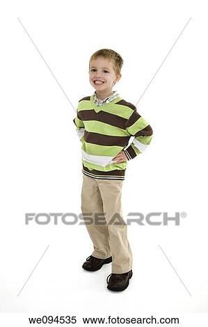 Young caucasian boy dressed in a casual outfit and standing on a white background View Large Photo Image Stock Photography - Young caucasian boy dressed in a casual outfit and standing on a white background. Fotosearch