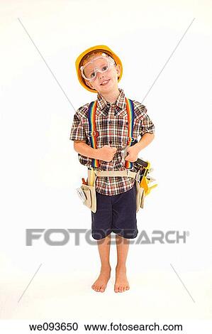Young caucasian boy dressed in a carpenter outfit standing on a white background View Large Photo Image Stock Image - Young caucasian boy dressed in a carpenter outfit standing on a white background. Fotosearch