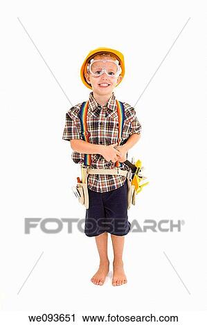 Young caucasian boy dressed in a carpenter outfit standing on a white background View Large Photo Image Stock Image - Young caucasian boy dressed in a carpenter outfit standing on a white background. Fotosearch