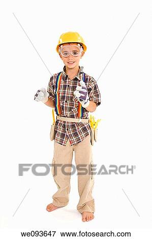 Young caucasian boy dressed in a carpenter outfit standing on a white background View Large Photo Image Stock Photo - Young caucasian boy dressed in a carpenter outfit standing on a white background. Fotosearch