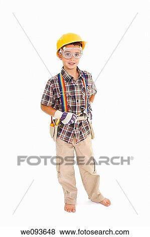 Young caucasian boy dressed in a carpenter outfit standing on a white background View Large Photo Image Stock Photo - Young caucasian boy dressed in a carpenter outfit standing on a white background. Fotosearch