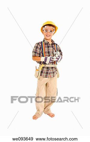Young caucasian boy dressed in a carpenter outfit standing on a white background View Large Photo Image Stock Photo - Young caucasian boy dressed in a carpenter outfit standing on a white background. Fotosearch
