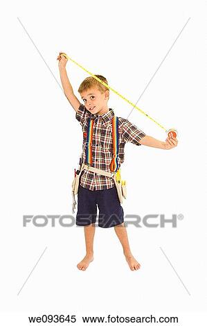 Young caucasian boy dressed in a carpenter outfit standing on a white background View Large Photo Image Stock Photography - Young caucasian boy dressed in a carpenter outfit standing on a white background. Fotosearch