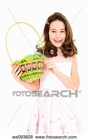 Young caucasian girl dressed in a Easter dress and standing on a white background View Large Photo Image Stock Photo - Young caucasian girl dressed in a Easter dress and standing on a white background. Fotosearch