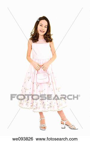 Young caucasian girl dressed in a Easter dress and standing on a white background View Large Photo Image Stock Photograph - Young caucasian girl dressed in a Easter dress and standing on a white background. Fotosearch