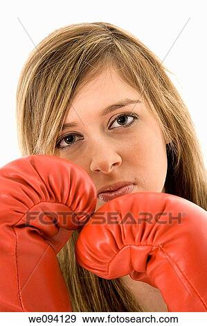 Young Caucasian teenager in red boxing gloves getting ready to fight View Large Photo Image Stock Photo - Young Caucasian teenager in red boxing gloves getting ready to fight. Fotosearch