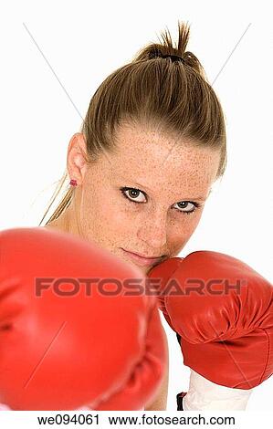 Young Caucasian woman in red boxing gloves getting ready to fight View Large Photo Image Stock Image - Young Caucasian woman in red boxing gloves getting ready to fight. Fotosearch