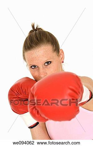 Young Caucasian woman in red boxing gloves getting ready to fight View Large Photo Image Stock Image - Young Caucasian woman in red boxing gloves getting ready to fight. Fotosearch