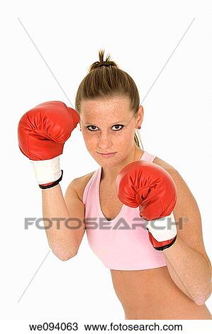 Young Caucasian woman in red boxing gloves getting ready to fight View Large Photo Image Stock Image - Young Caucasian woman in red boxing gloves getting ready to fight. Fotosearch