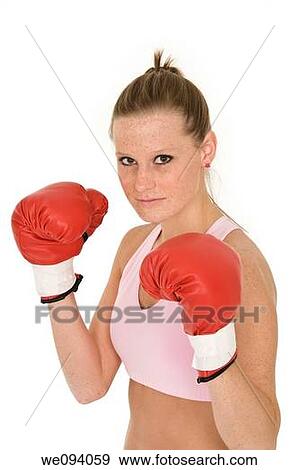Young Caucasian woman in red boxing gloves getting ready to fight View Large Photo Image Stock Photo - Young Caucasian woman in red boxing gloves getting ready to fight. Fotosearch