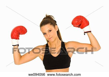 Young Caucasian woman in red boxing gloves showing a sign of victory View Large Photo Image Stock Photograph - Young Caucasian woman in red boxing gloves showing a sign of victory. Fotosearch