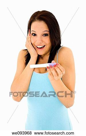 Young Caucasian woman looking at pregnancy test View Large Photo Image Stock Photo - Young Caucasian woman looking at pregnancy test. Fotosearch