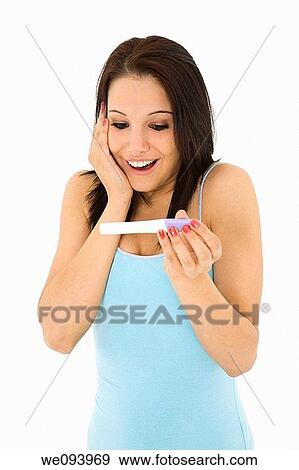 Young Caucasian woman looking at pregnancy test View Large Photo Image Stock Photo - Young Caucasian woman looking at pregnancy test. Fotosearch
