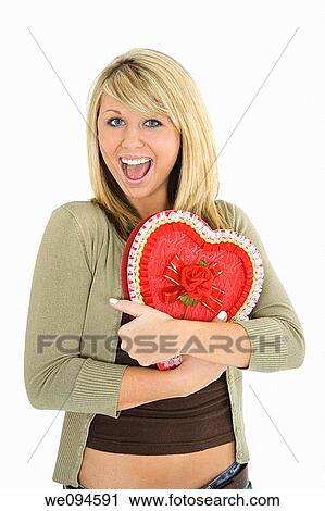 Young Caucasian woman very excited after recieving a special gift View Large Photo Image Stock Image - Young Caucasian woman very excited after recieving a special gift. Fotosearch