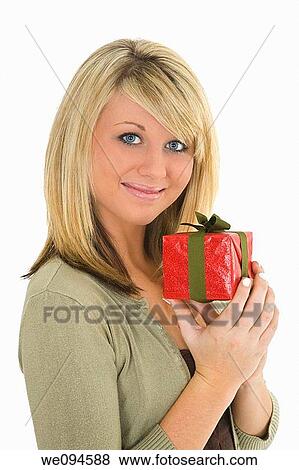 Young Caucasian woman very excited after recieving a special gift View Large Photo Image Stock Photo - Young Caucasian woman very excited after recieving a special gift. Fotosearch