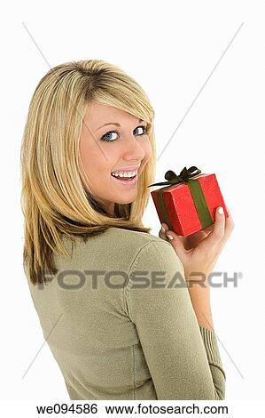 Young Caucasian woman very excited after recieving a special gift View Large Photo Image Stock Photograph - Young Caucasian woman very excited after recieving a special gift. Fotosearch