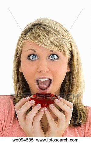 Young Caucasian woman very excited after recieving a special gift View Large Photo Image Stock Photography - Young Caucasian woman very excited after recieving a special gift. Fotosearch