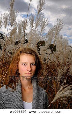 Young girl in a stand of tall wild white plumed Pampas Grass in the Fall View Large Photo Image Stock Image - Young girl in a stand of tall wild white plumed Pampas Grass in the Fall. Fotosearch