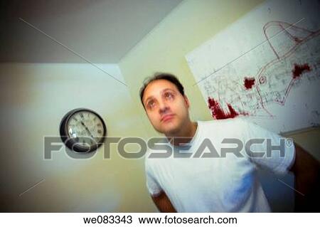 Young man posing in his apartment. View Large Photo Image Stock Image - Young man posing in his apartment.. Fotosearch