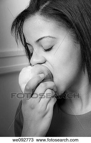 Young woman eating an apple View Large Photo Image Stock Image - Young woman eating an apple. Fotosearch