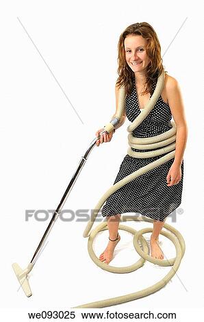 Young woman homemaker tangled in vacuum cleaner hose on white background View Large Photo Image Stock Photography - Young woman homemaker tangled in vacuum cleaner hose on white background. Fotosearch