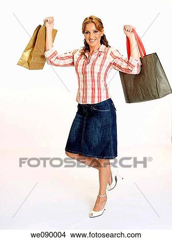 Picture - Young woman shopping.. Fotosearch