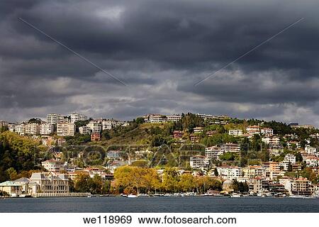 Bebek harbour Istanbul with storm clouds and sun over apartments on hill and Egyptian Consulate View Large Photo Image Stock Photo - Bebek harbour Istanbul with storm clouds and sun over apartments on hill and Egyptian Consulate. Fotosearch