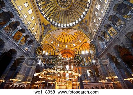 Stock Photo - Ceiling domes and lit chandeliers with six winged Saraphim in the Hagia Sophia Istanbul. Fotosearch