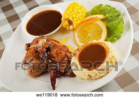 Chicken served with mashed potatos and gravy and a side of corn View Large Photo Image Stock Photo - Chicken served with mashed potatos and gravy and a side of corn. Fotosearch