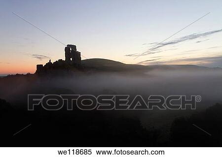 Corfe Castle at dawn on a misty autumnal morning, Dorset, England, UK View Large Photo Image Stock Photography - Corfe Castle at dawn on a misty autumnal morning, Dorset, England, UK. Fotosearch