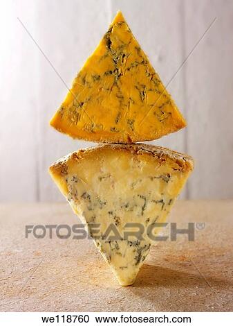 English blue cheese wedges - stilton, white stilton amd blacksticks View Large Photo Image Stock Image - English blue cheese wedges - stilton, white stilton amd blacksticks. Fotosearch