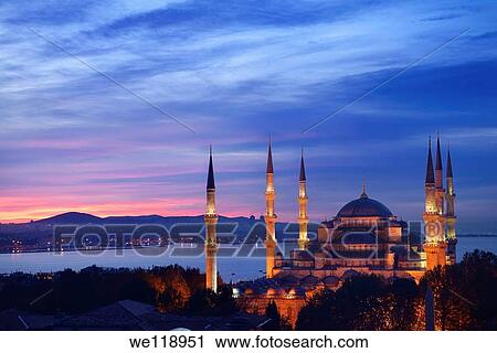 Stock Image - Lights on the Blue Mosque with red sky in the morning on the Bosphorus Sultanahmet Istanbul Turkey. Fotosearch