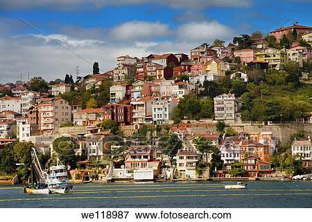 Purse Seine fishing boat on the Bosphorus Strait with houses on hill at Yeni Mahalle Sariyer Turkey View Large Photo Image Stock Photo - Purse Seine fishing boat on the Bosphorus Strait with houses on hill at Yeni Mahalle Sariyer Turkey. Fotosearch